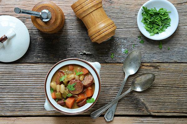 Braised Sausage and White Beans in Savory Peanut Butter Sauce
